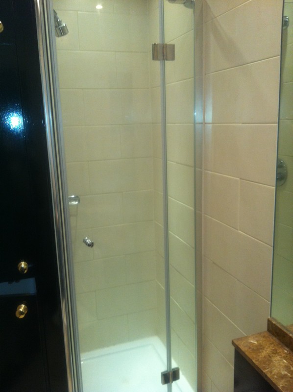 Frameless glass shower enclosure with chrome fittings in Paddington